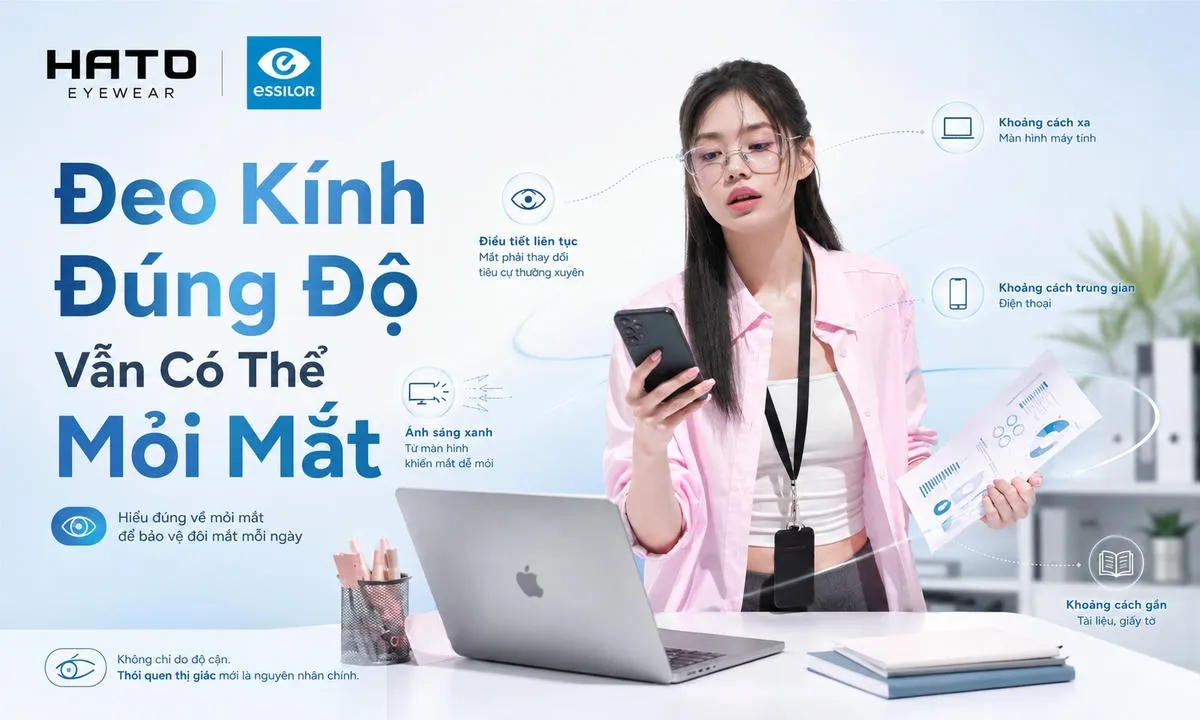 Ảnh minh họa người đeo kính đang làm việc với laptop, điện thoại và tài liệu cùng lúc, thể hiện việc mắt phải chuyển đổi liên tục giữa nhiều khoảng nhìn và có thể gây mỏi mắt.