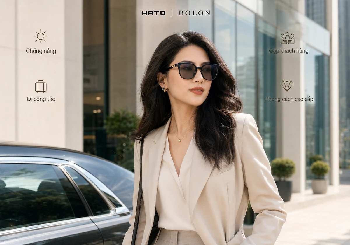 Người mẫu công sở đeo kính mát Bolon thanh lịch, phù hợp đi làm, gặp khách hàng và công tác.
