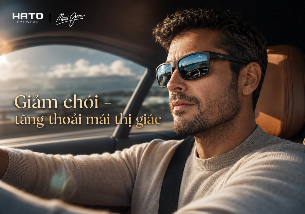 Người đàn ông đeo kính Maui Jim có độ khi lái xe, hỗ trợ giảm chói và tăng sự thoải mái thị giác ban ngày.